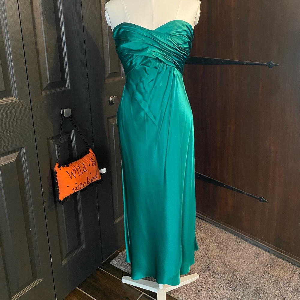 Emerald green tea length dress.